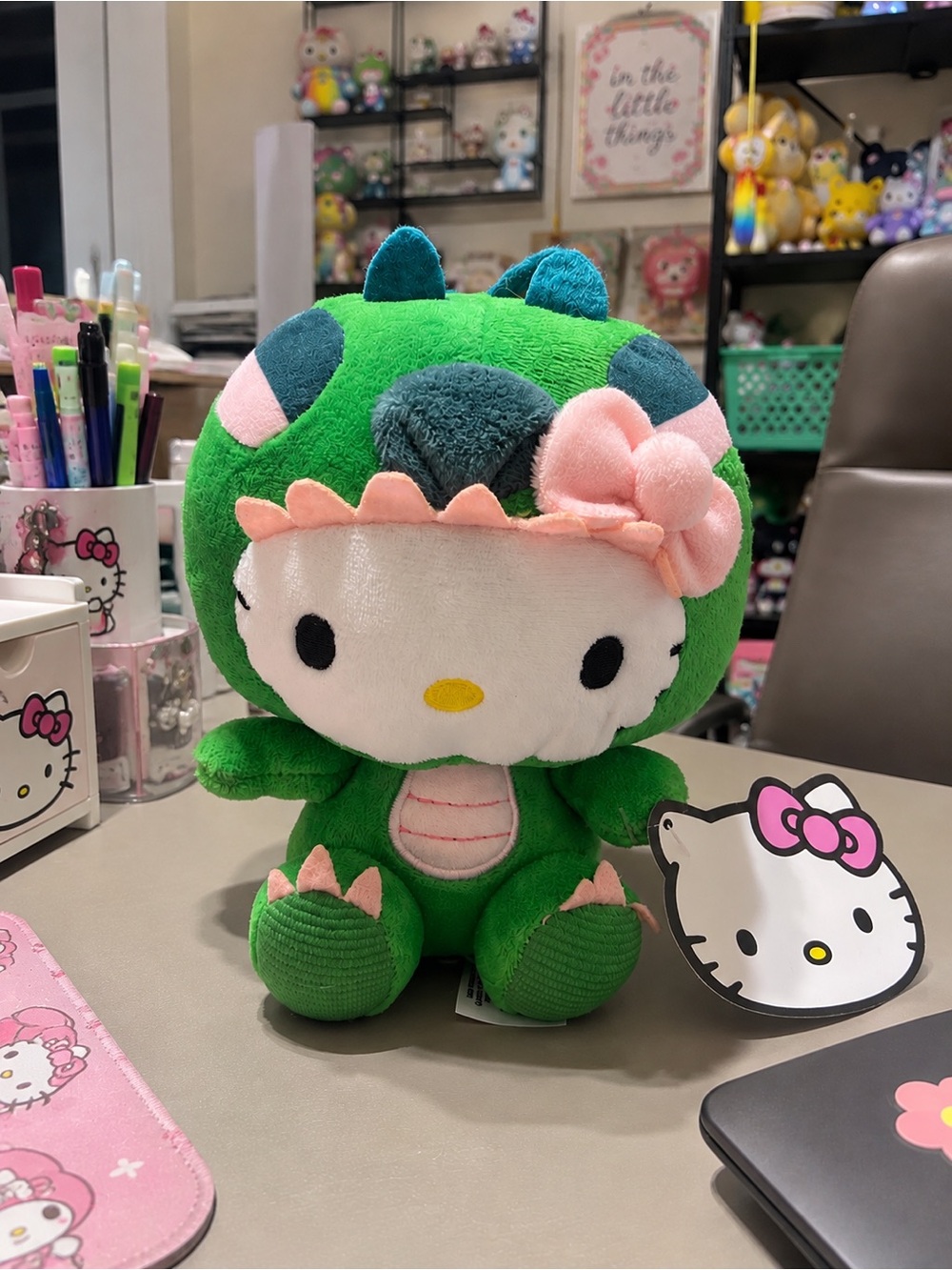 is a Fiesta Sanrio Hello Kitty Green Dragon/Dinosaur Costume Plush